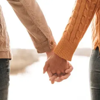 Couple holding hands