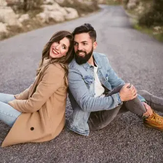 Couple sitting on the road