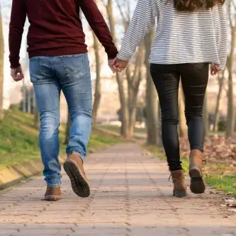 Couple walking holding hands